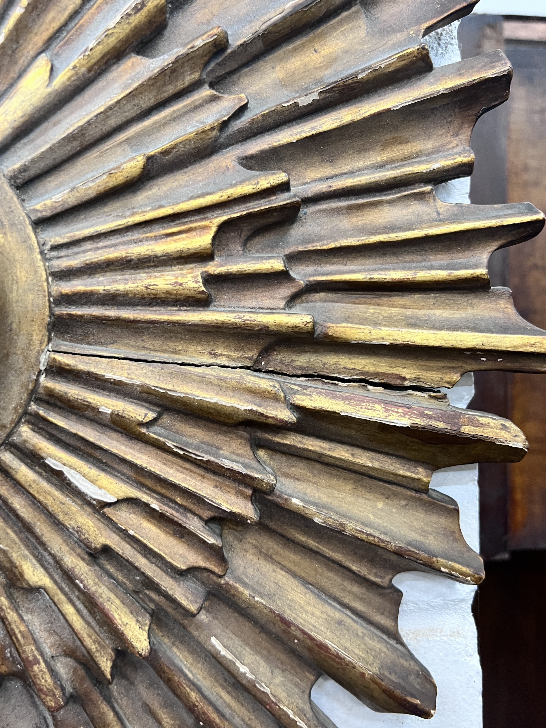 An early 20th century sunburst wall timepiece, diameter 50cm